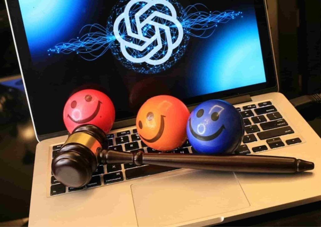 Gavel and smiley balls on laptop