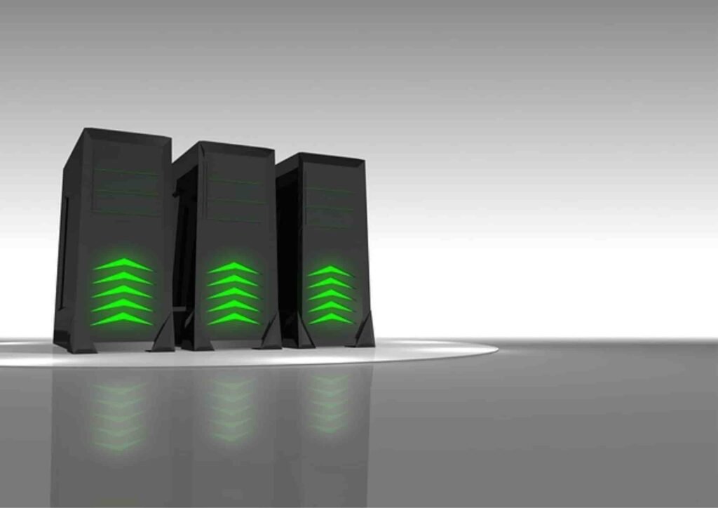 Three sleek black server towers with glowing green accents, standing on a reflective surface against a gradient gray background.