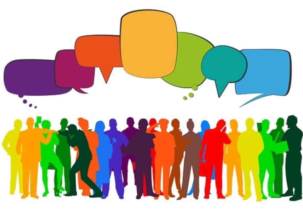 people engaged in conversation with speech bubbles above them, symbolizing collaboration, communication, and teamwork in Salesforce environments.